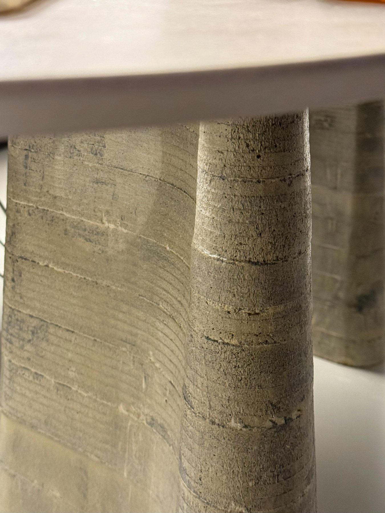 Trace — cast concrete leg, surface texture